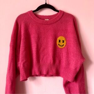 Pink urban outfitters smiley crop sweater